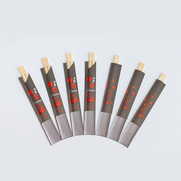 Chinesische japanische Bambuswegwerfessstäbchen mit in Papier eingewickeltem